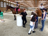 Anne Luke, owner of Holly Ridge Farm Equestrian Center near Willards, MD, center, introduces some lesson horses and instructors to visitors of the facilities 2010 open house.